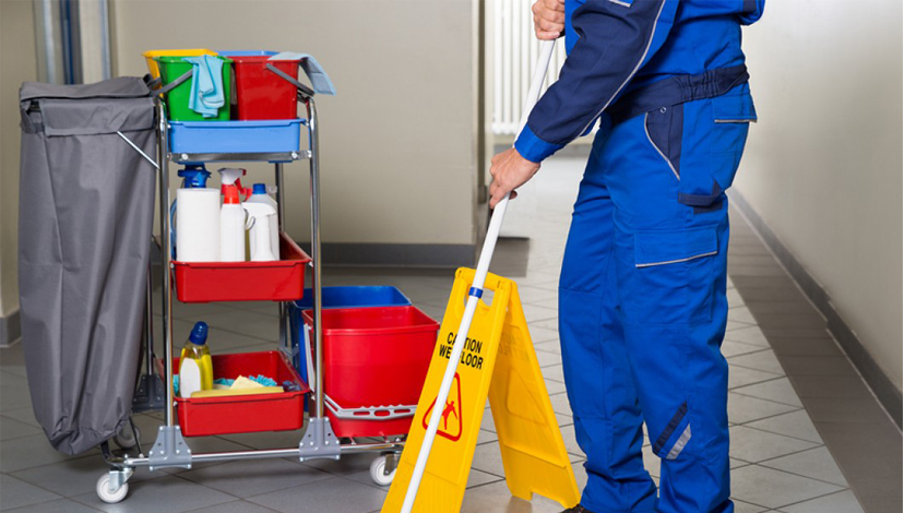 bigstock-Janitor-With-Broom-Cleaning-Of-113497175